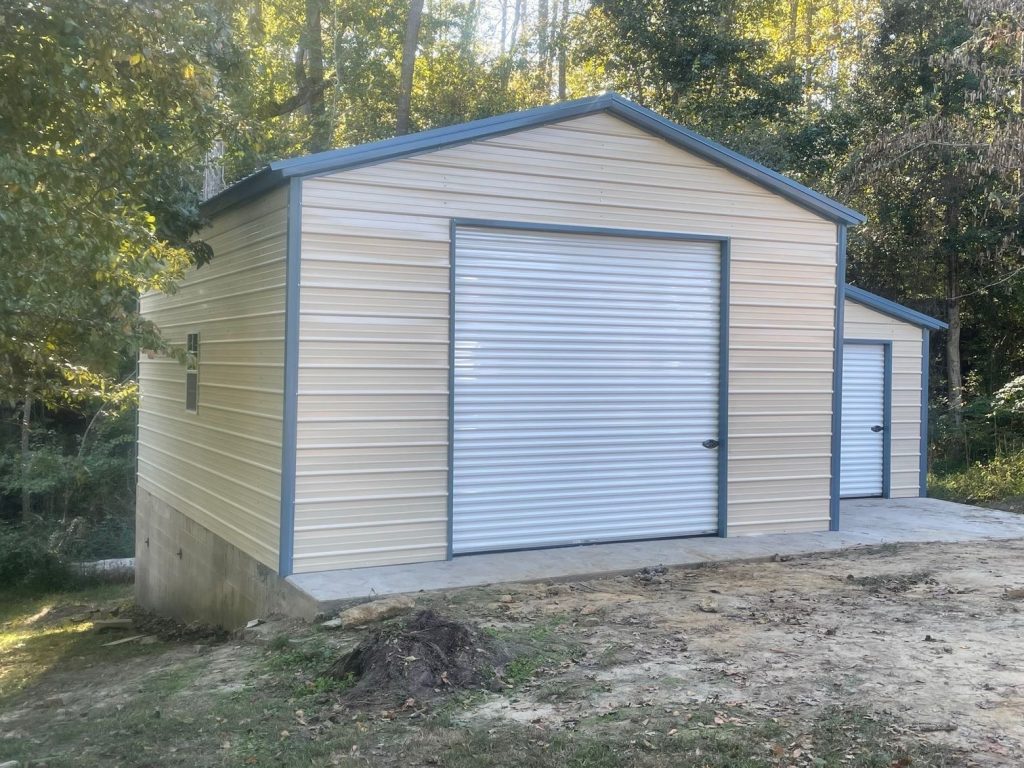 A yellow metal garage with two vehicle ports.